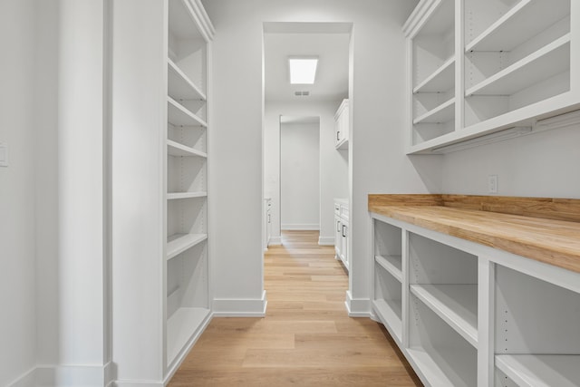 walk in closet featuring light wood-type flooring