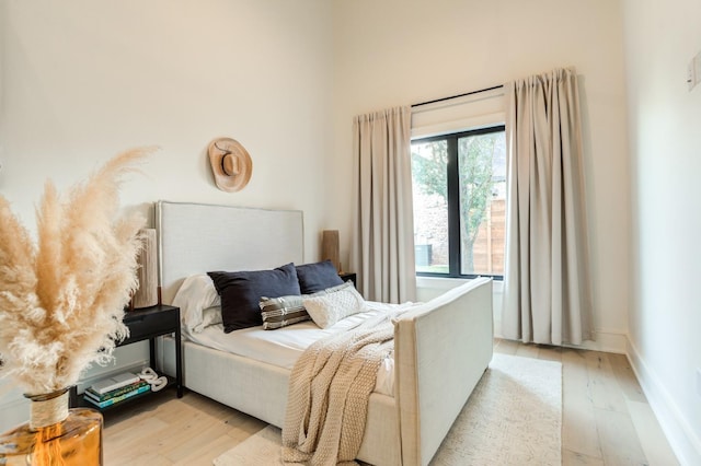 bedroom with light hardwood / wood-style flooring