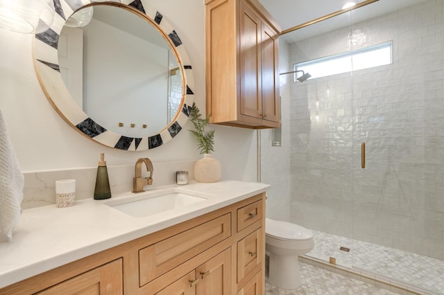 bathroom with a shower with door, vanity, and toilet