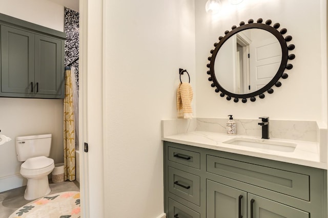 bathroom featuring vanity, toilet, and a shower with shower curtain