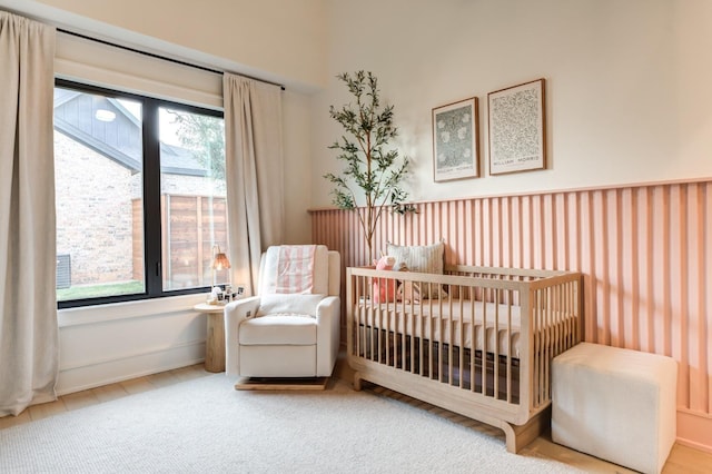 bedroom featuring a crib