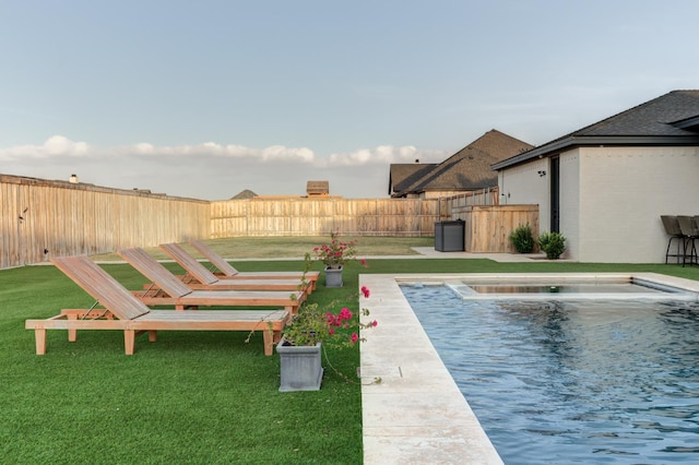 view of pool featuring a yard