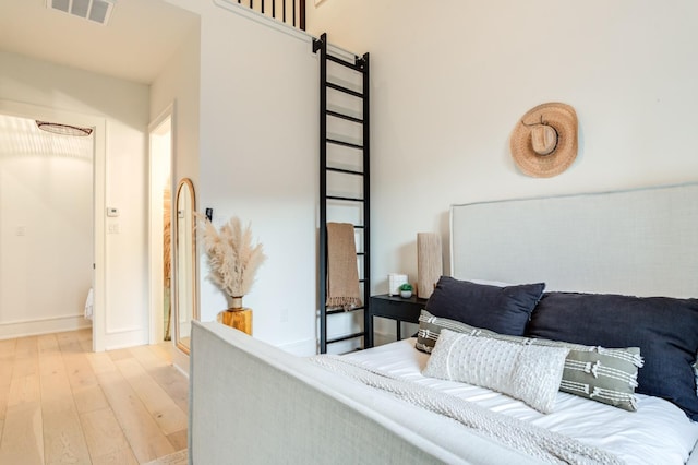 bedroom featuring light hardwood / wood-style floors