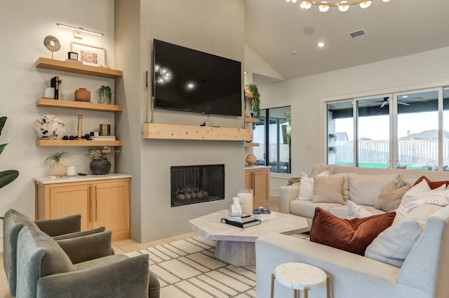 living room featuring lofted ceiling and ceiling fan