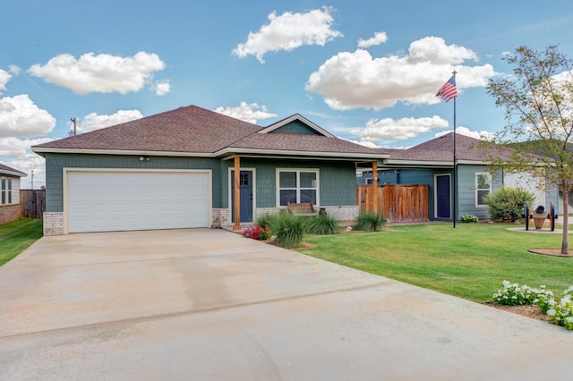 ranch-style house with a garage and a front yard