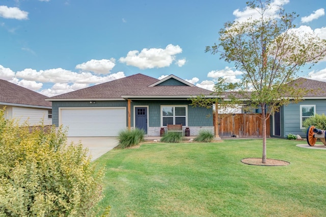 ranch-style home with a garage and a front lawn