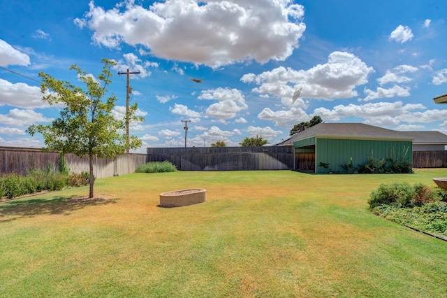 view of yard with an outdoor fire pit