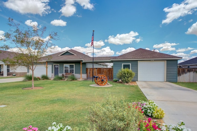 single story home with a garage and a front lawn