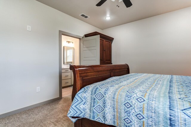 carpeted bedroom featuring connected bathroom and ceiling fan