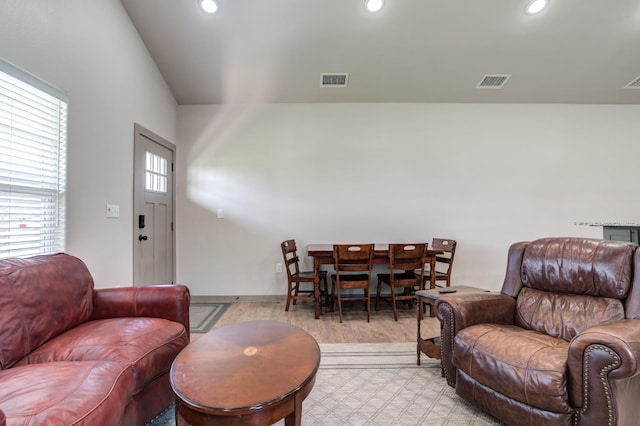 living room with light hardwood / wood-style flooring