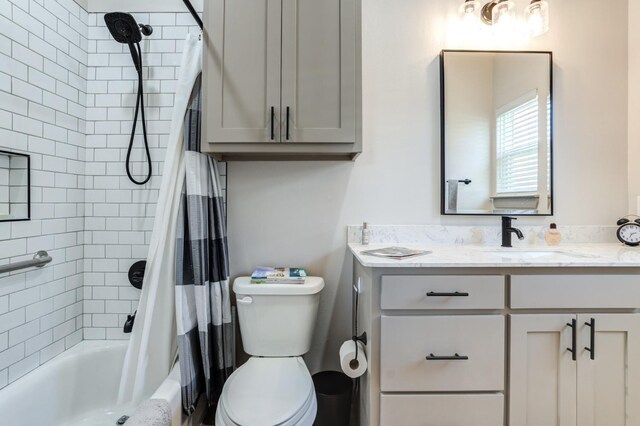 full bathroom with vanity, toilet, and shower / bath combo with shower curtain