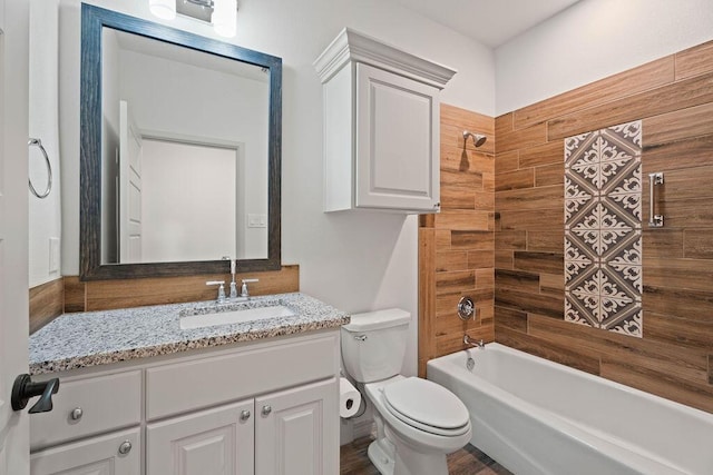 bathroom with vanity, toilet, and shower / bathtub combination