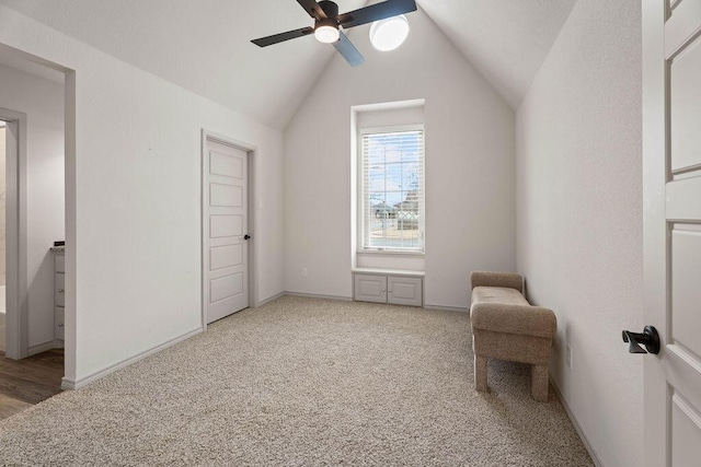 additional living space featuring baseboards, vaulted ceiling, a ceiling fan, and light colored carpet