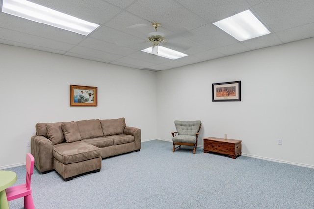 6910 Freeport Ave, Lubbock, TX 79424 - carpeted living room featuring a drop ceiling and baseboards
