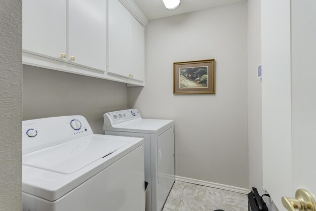 6910 Freeport Ave, Lubbock, TX 79424 - washroom featuring washer and dryer, cabinet space, and baseboards