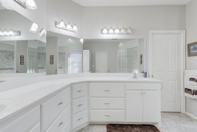 6910 Freeport Ave, Lubbock, TX 79424 - full bathroom featuring double vanity and marble finish floors