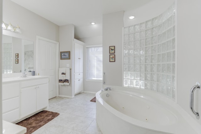 6910 Freeport Ave, Lubbock, TX 79424 - bathroom with vanity, a tub with jets, and recessed lighting