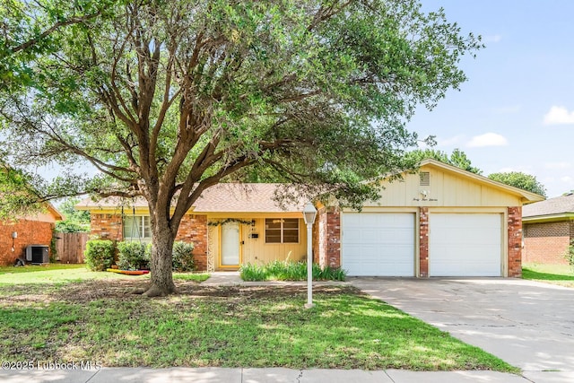 4411 58th St, Lubbock, TX 79414 - single story home featuring an attached garage, concrete driveway, and brick siding