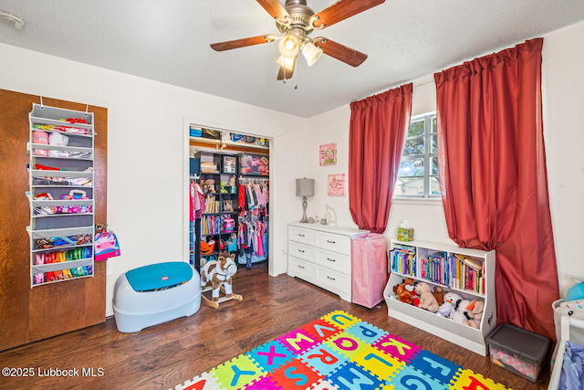 4411 58th St, Lubbock, TX 79414 - playroom with wood finished floors and ceiling fan
