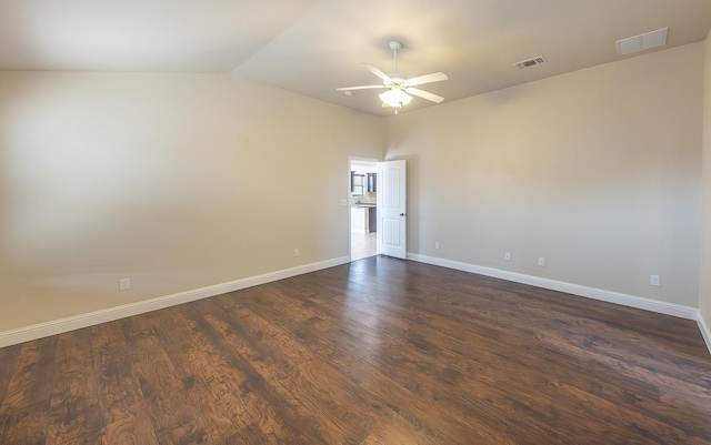 unfurnished room with lofted ceiling, dark wood-type flooring, and ceiling fan