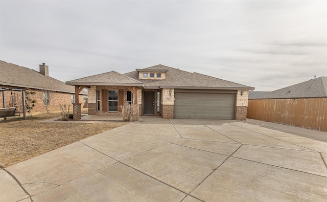 prairie-style home with a garage and covered porch