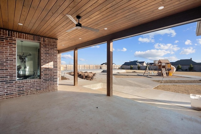 view of patio / terrace featuring ceiling fan and a playground