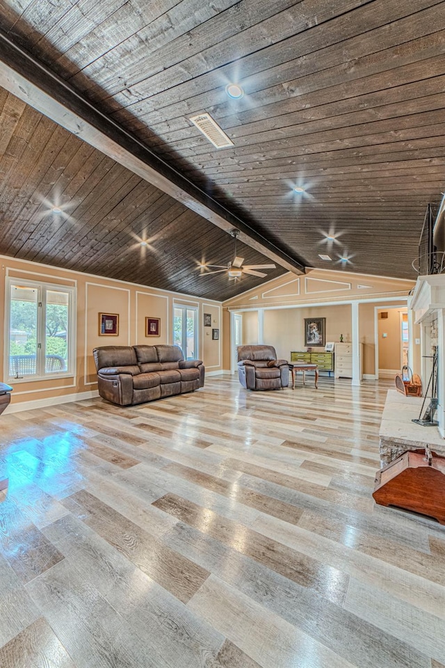 unfurnished living room with wood ceiling, ceiling fan, light wood-type flooring, and vaulted ceiling with beams