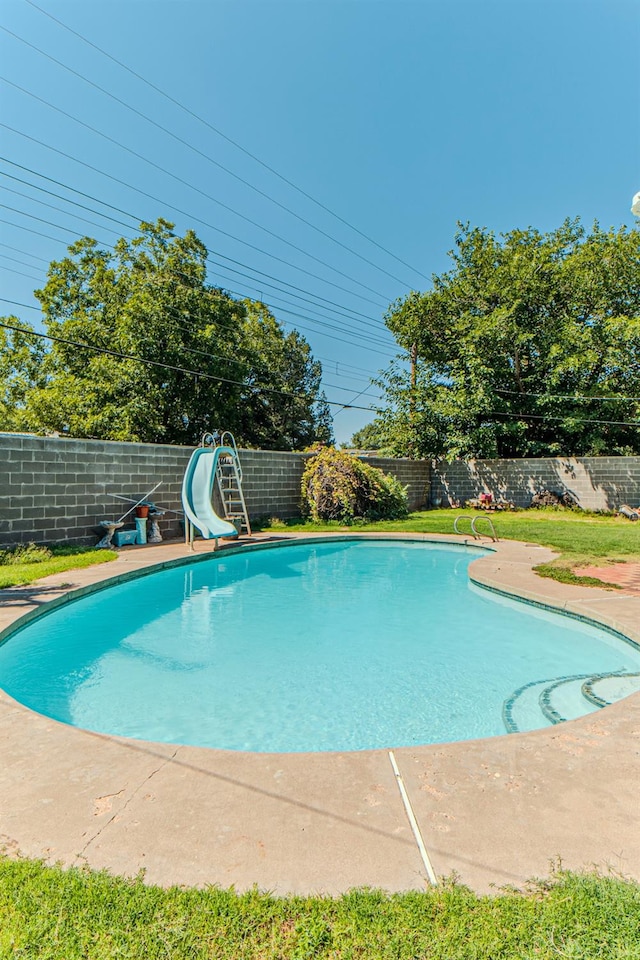 view of pool featuring a water slide