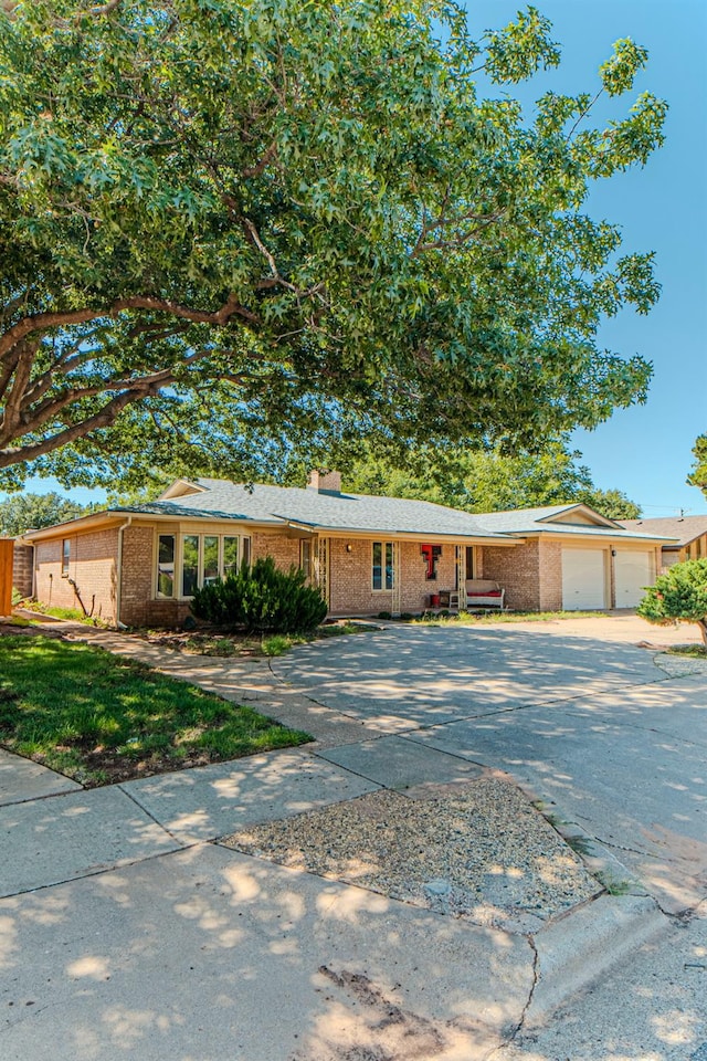 single story home with a garage