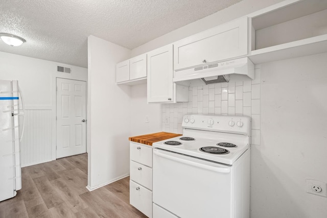 kitchen featuring wooden counters, white cabinets, white appliances, a textured ceiling, and light wood-type flooring