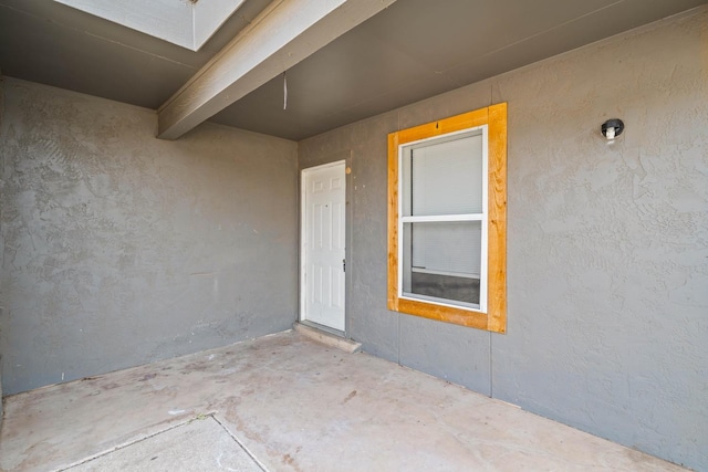 doorway to property featuring a patio area