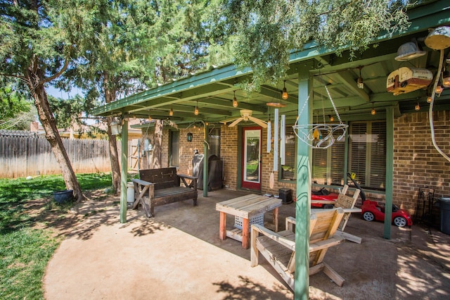 view of patio / terrace featuring fence