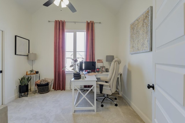 home office featuring vaulted ceiling and light colored carpet