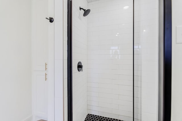 bathroom with a tile shower