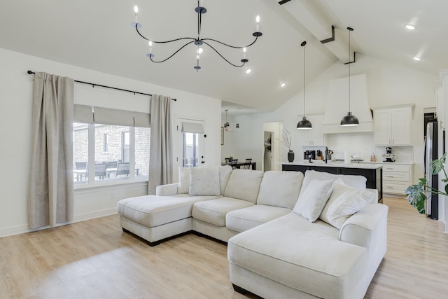 living room with beamed ceiling, high vaulted ceiling, light wood-type flooring, and a chandelier