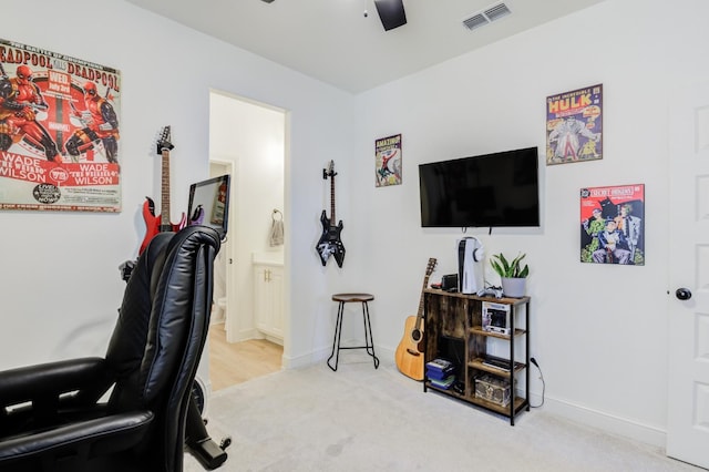 workout room featuring carpet floors and ceiling fan