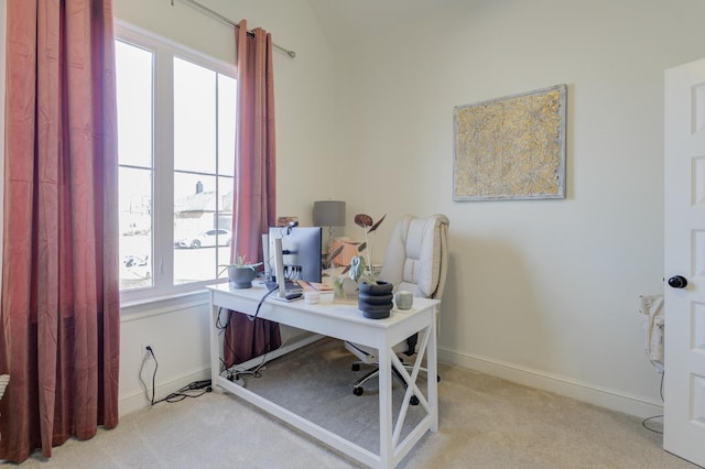 home office featuring vaulted ceiling and light carpet