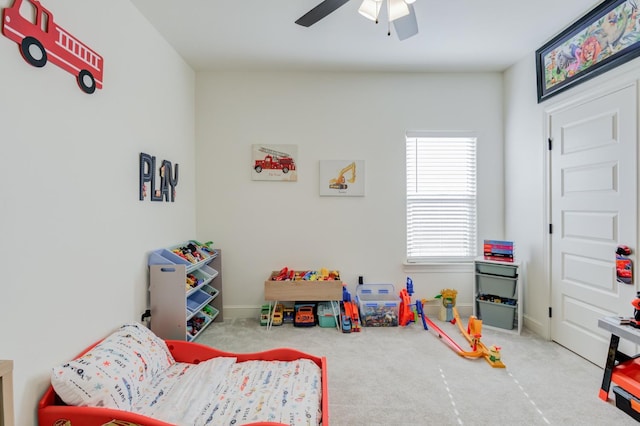 rec room with carpet floors and ceiling fan