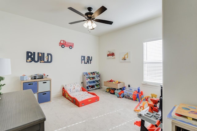 recreation room featuring ceiling fan and carpet flooring