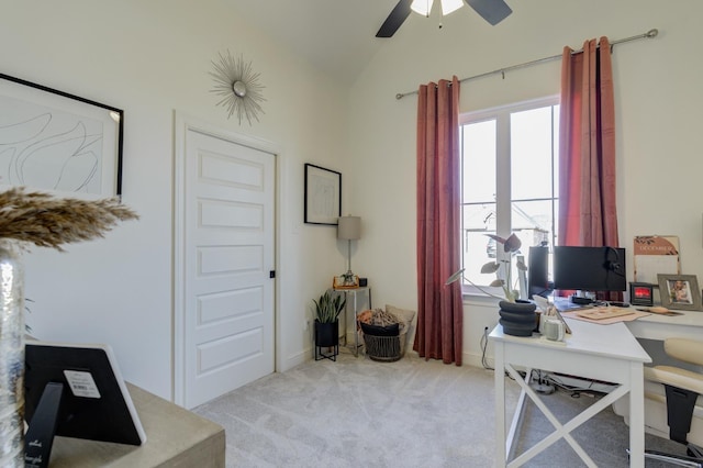 home office featuring lofted ceiling, light colored carpet, and ceiling fan