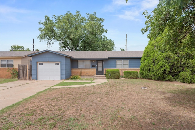 4416 33rd St, Lubbock, TX 79410 - ranch-style house with an attached garage, driveway, and brick siding