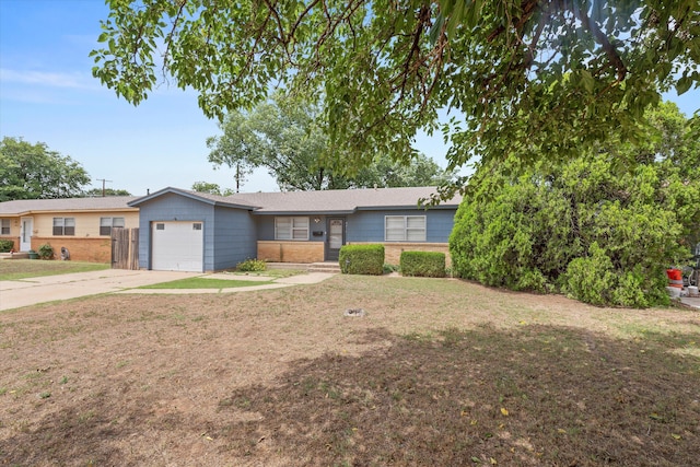 4416 33rd St, Lubbock, TX 79410 - ranch-style house featuring an attached garage, driveway, brick siding, and a front yard