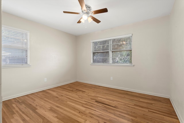 4416 33rd St, Lubbock, TX 79410 - empty room with healthy amount of natural light, light wood-style floors, and a ceiling fan