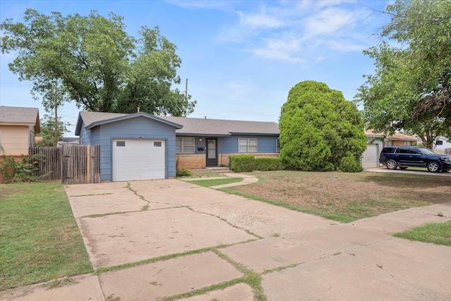4416 33rd St, Lubbock, TX 79410 - view of front facade featuring an attached garage, driveway, a shingled roof, and brick siding