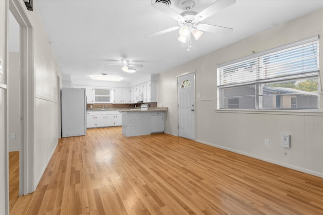 4416 33rd St, Lubbock, TX 79410 - unfurnished living room with light wood-style flooring and ceiling fan