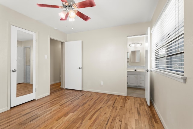 4416 33rd St, Lubbock, TX 79410 - unfurnished bedroom featuring light wood-type flooring, ensuite bathroom, and ceiling fan