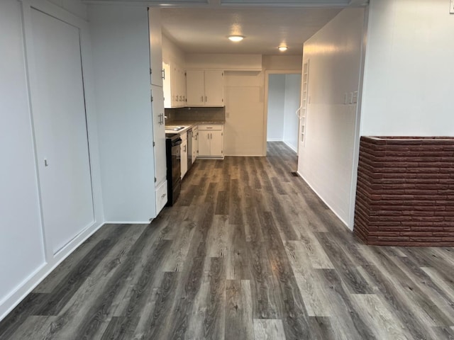 hallway featuring dark hardwood / wood-style floors and sink