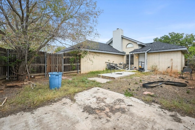 rear view of house with a patio