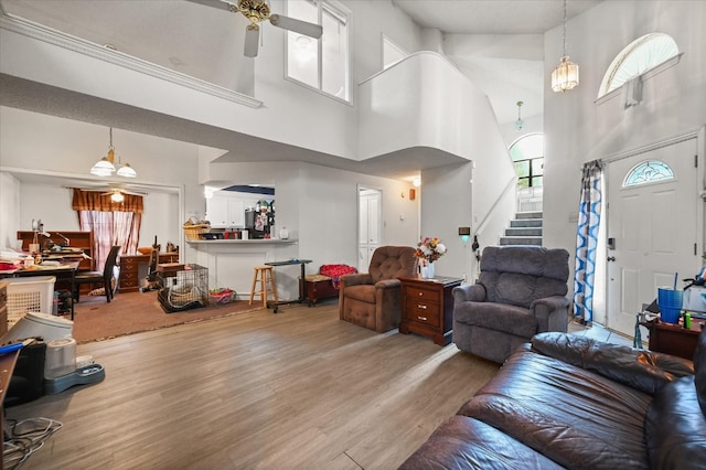 living room with ceiling fan and hardwood / wood-style floors