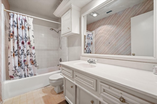 full bathroom featuring shower / tub combo, vanity, and toilet